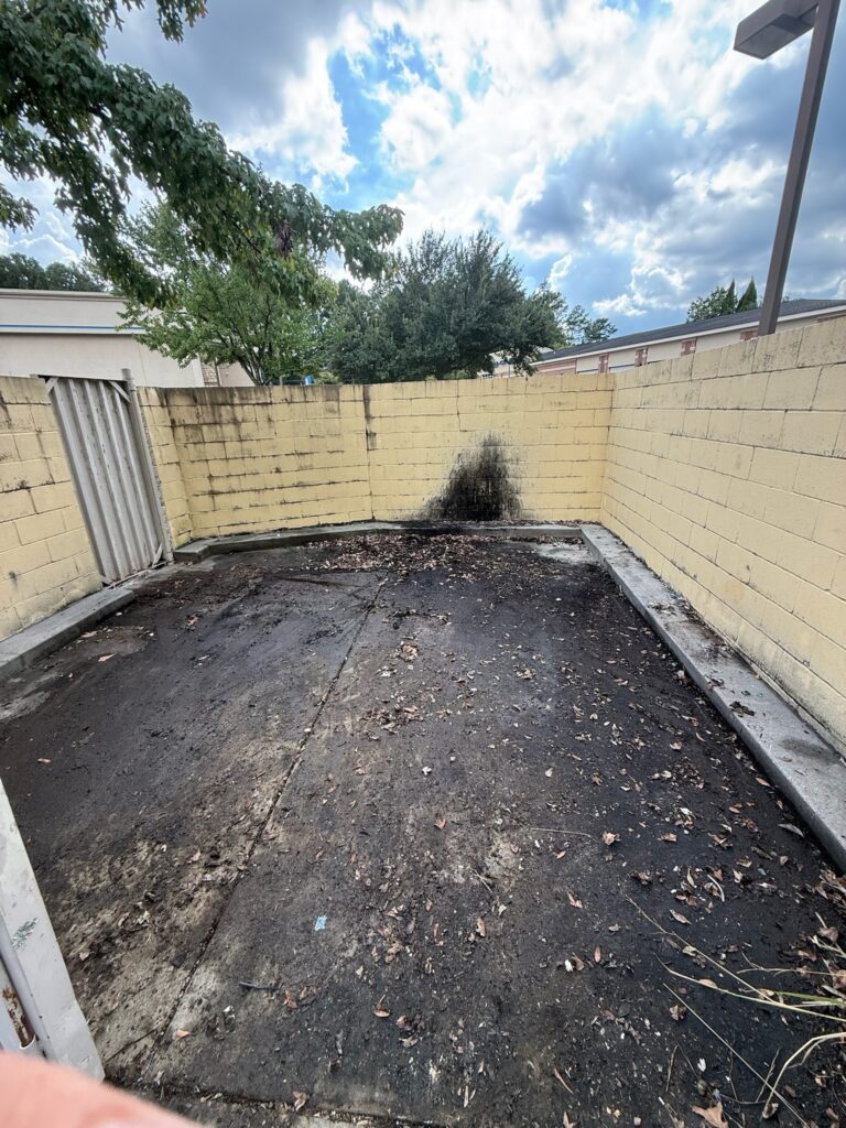 Commercial trash area after debris removal