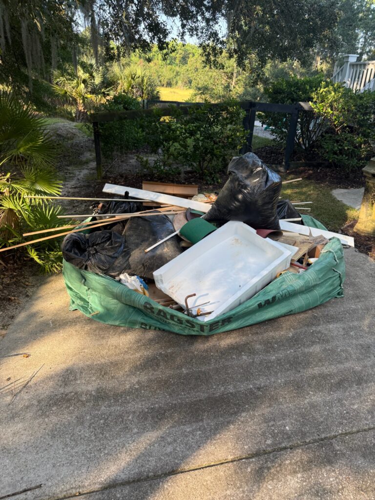 Pile of waste and trash on an outdoor yard